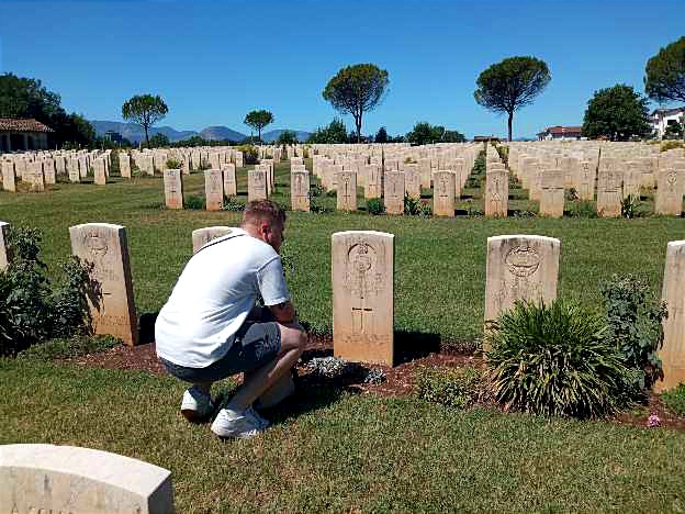Commonwealth cemetery. Grand_son in front of the gravestone of a soldier died on 23rd May 1944